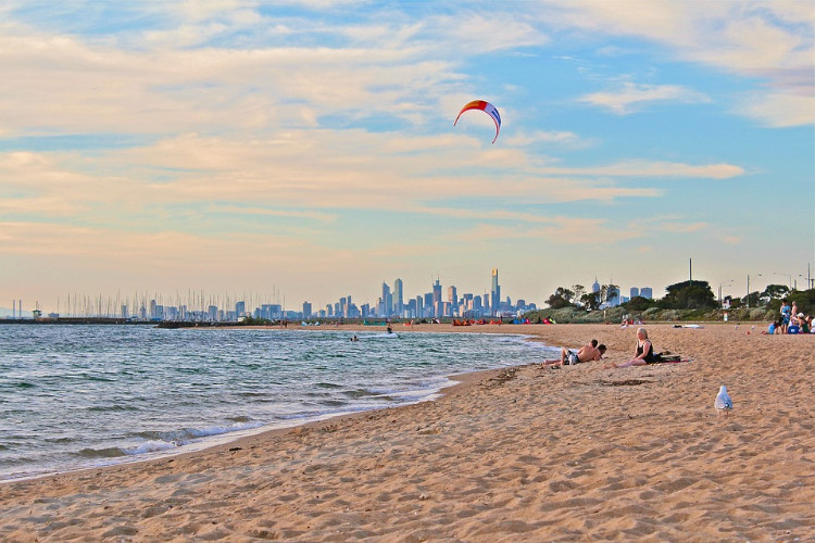 flying a kite on a beach near melboune